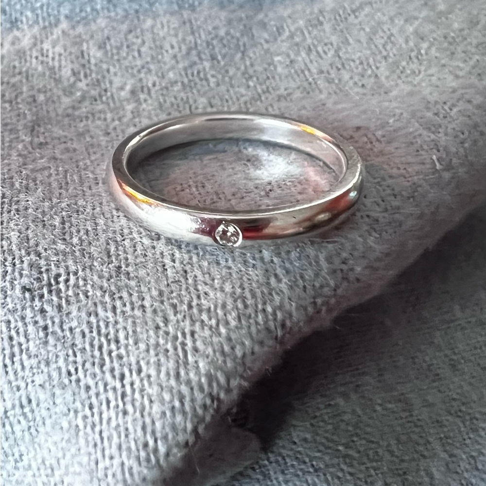 Tiffany & Co. Silver Band Ring with Single Diamond Accent